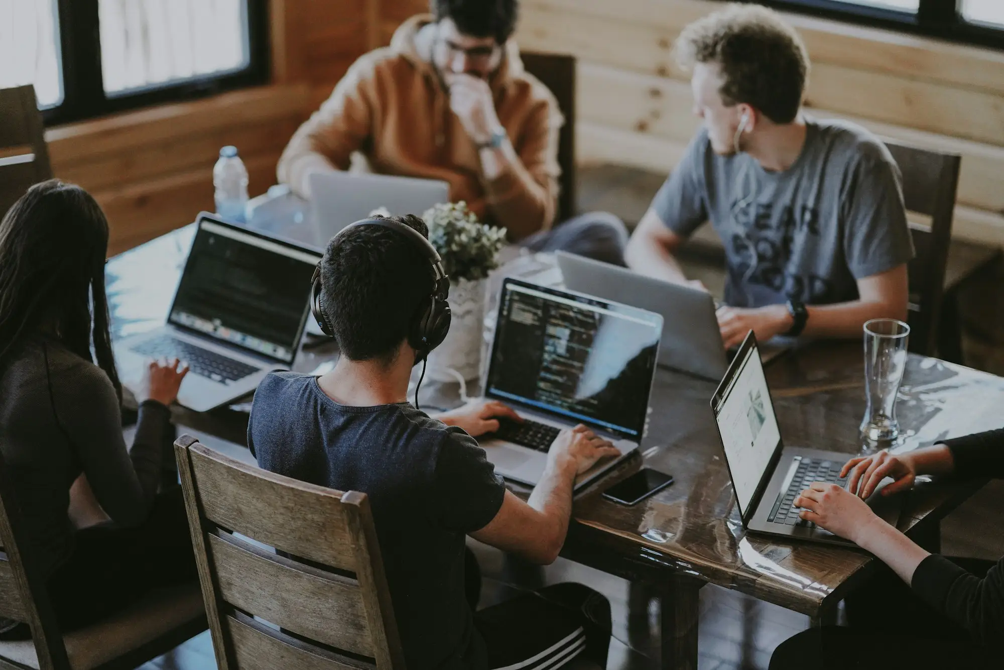 Group working on laptops together